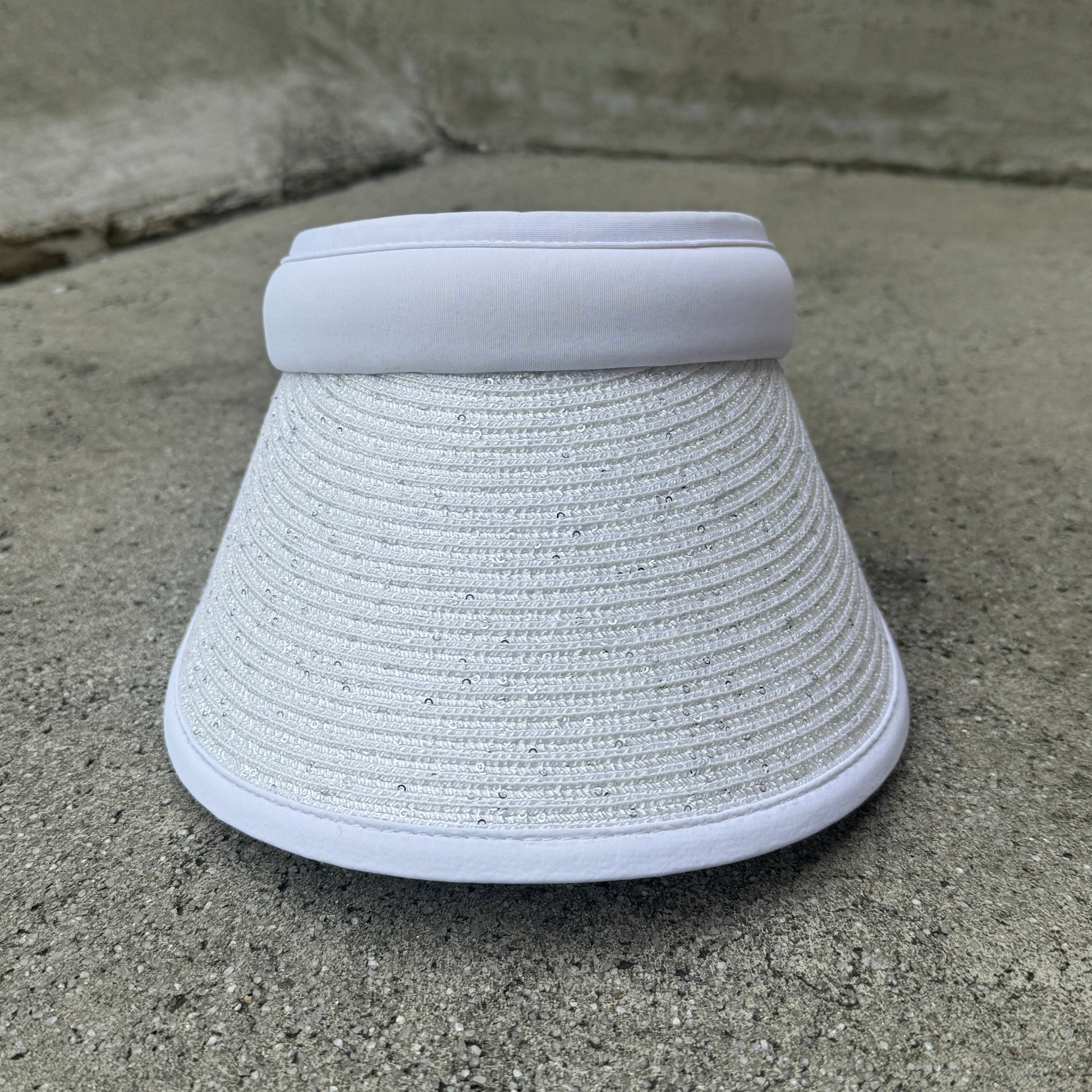 White woven basket on a concrete surface