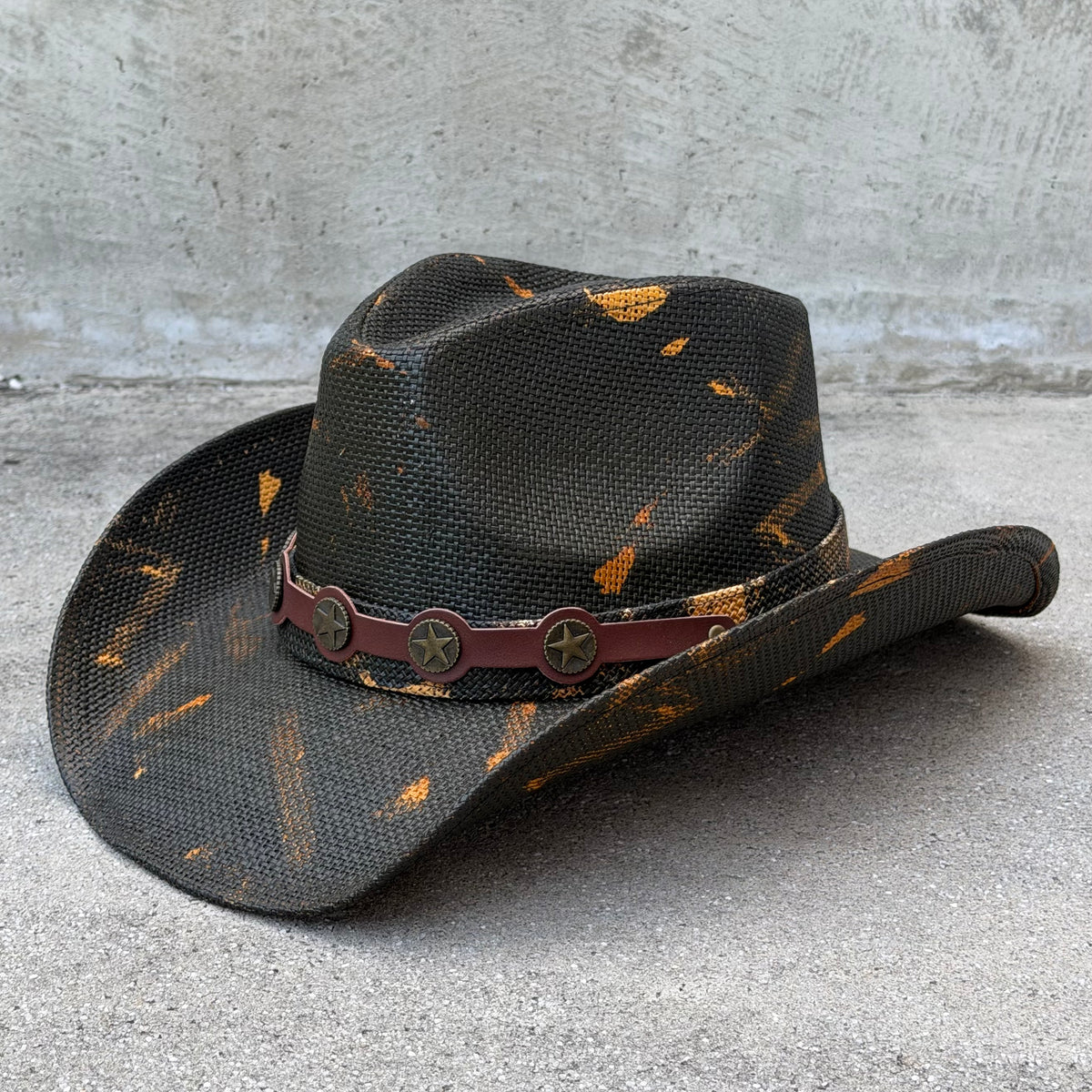 Angled view of the Coyote cowboy hat showing its curved brim and decorative band