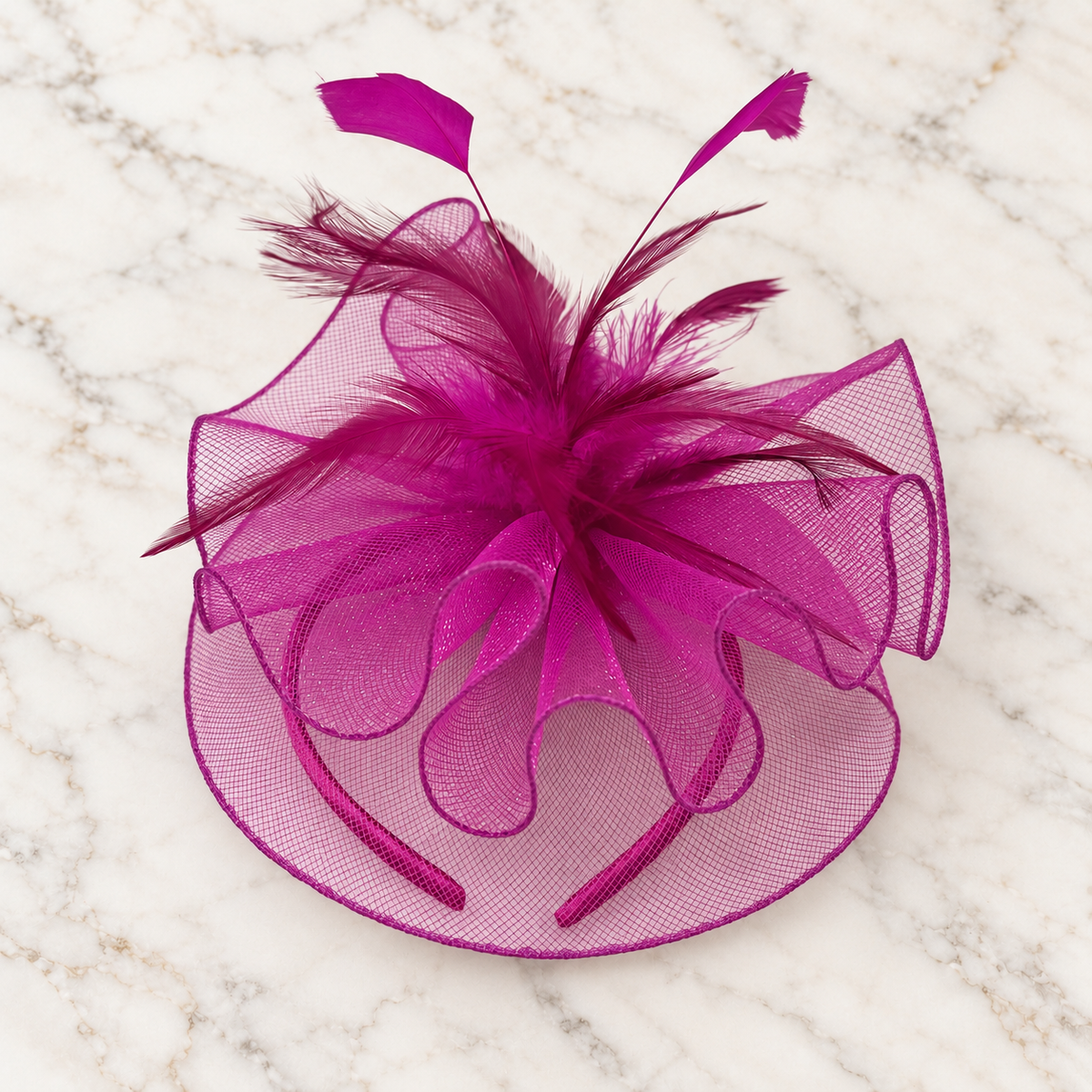Anastacia purple mesh and feather fascinator on light marble background