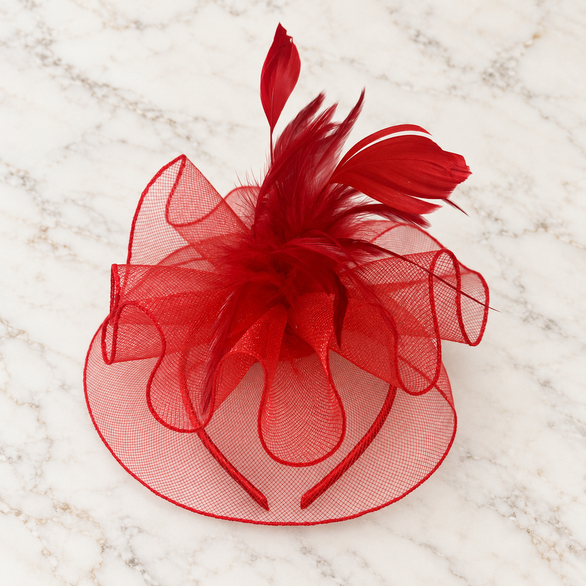 Anastacia red mesh and feather fascinator on light marble background