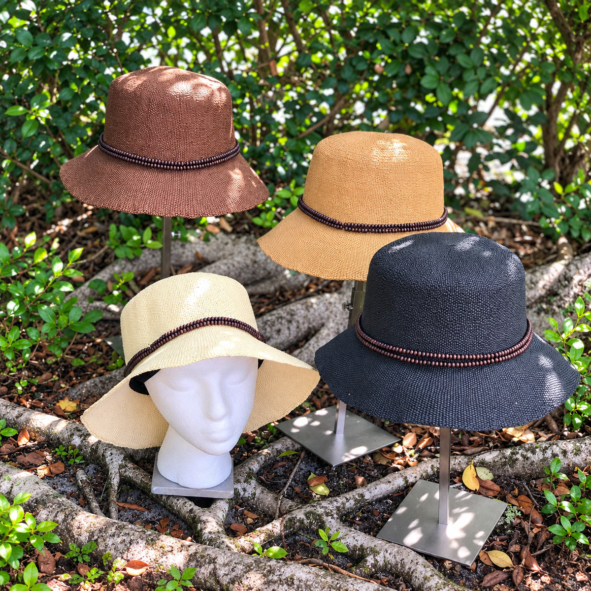 Assortment of Cora beaded bucket hats in light, natural, black and brown tones