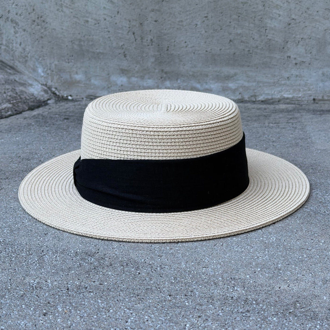 Lola Beige boater hat, front view on original gray concrete background