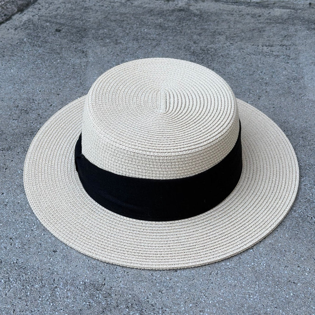 Lola Beige boater hat, overhead view showing flat crown and black ribbon