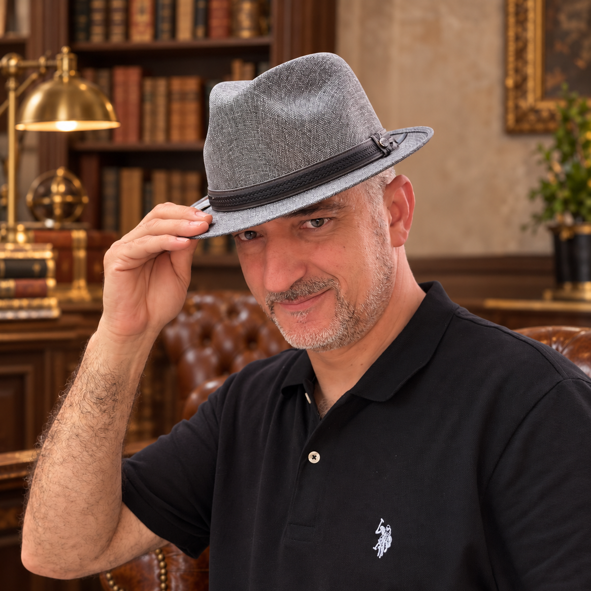 Man wearing Mia Gray structured linen fedora in a warm library interior