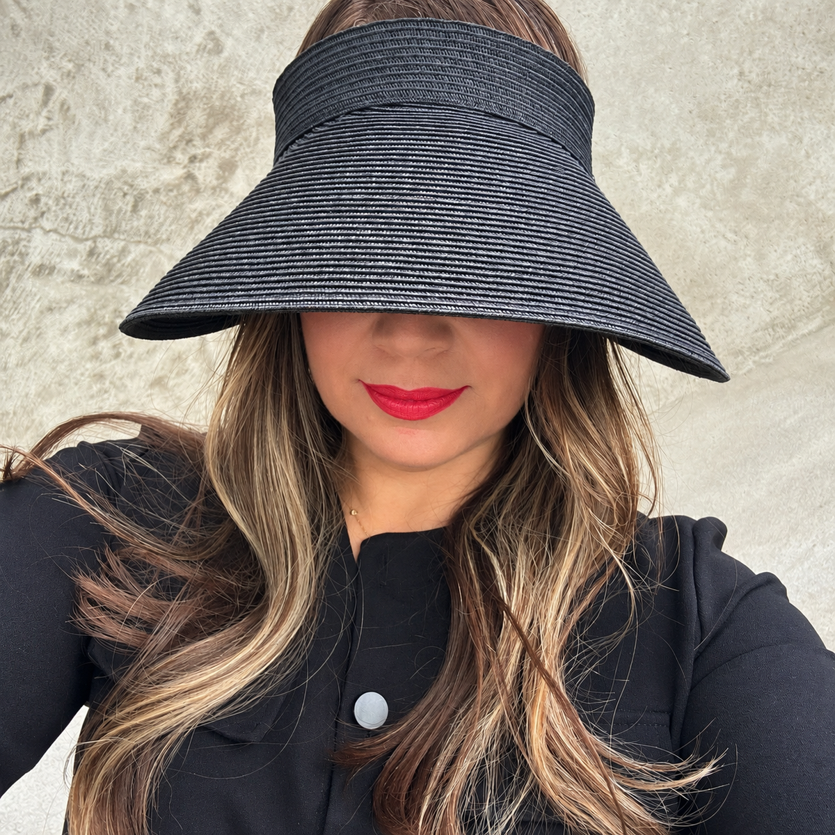Front view of a woman wearing the dark mixed brown Zara extra-wide brim sun visor.
