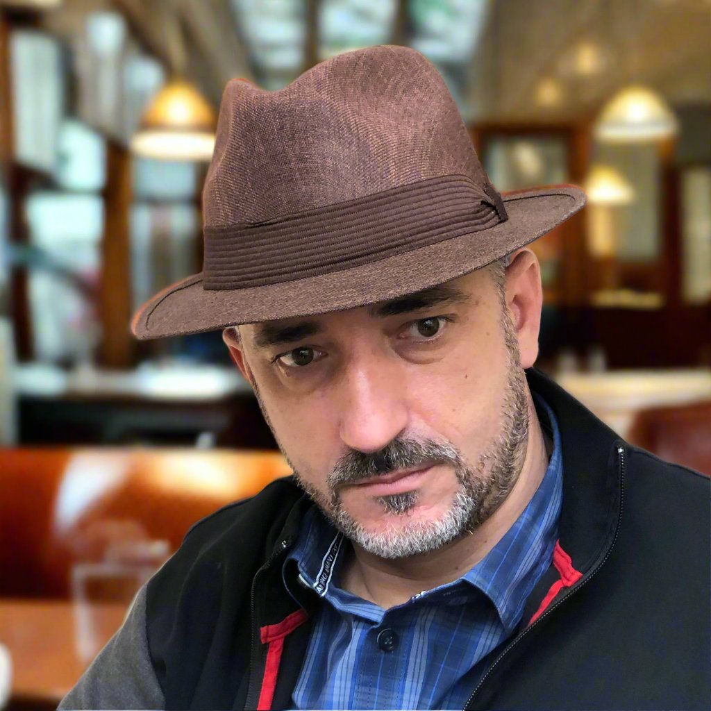 Man wearing Mia brown structured fedora indoors.
