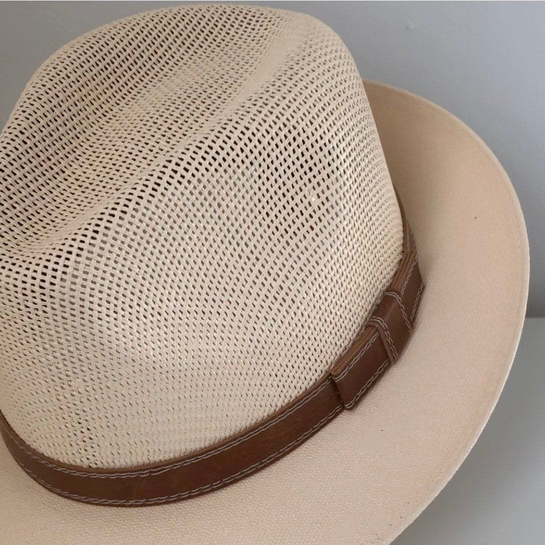 Close-up of Mara beige fedora's open weave and brown stitched band.