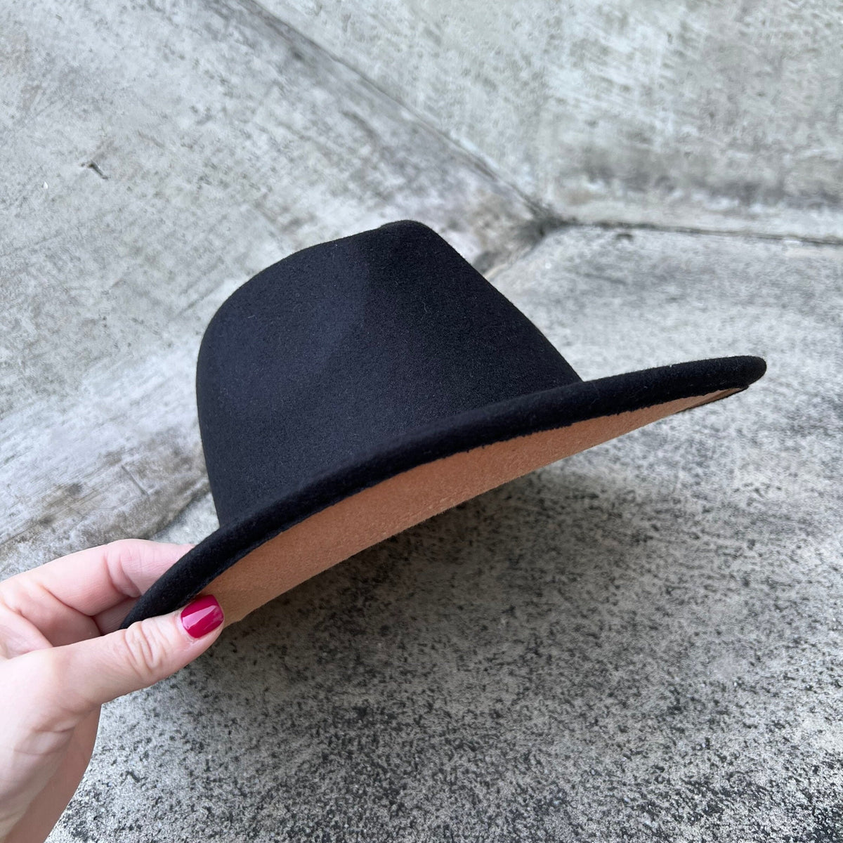 Side view of Zair black fedora showing its contrasting tan brim underside.