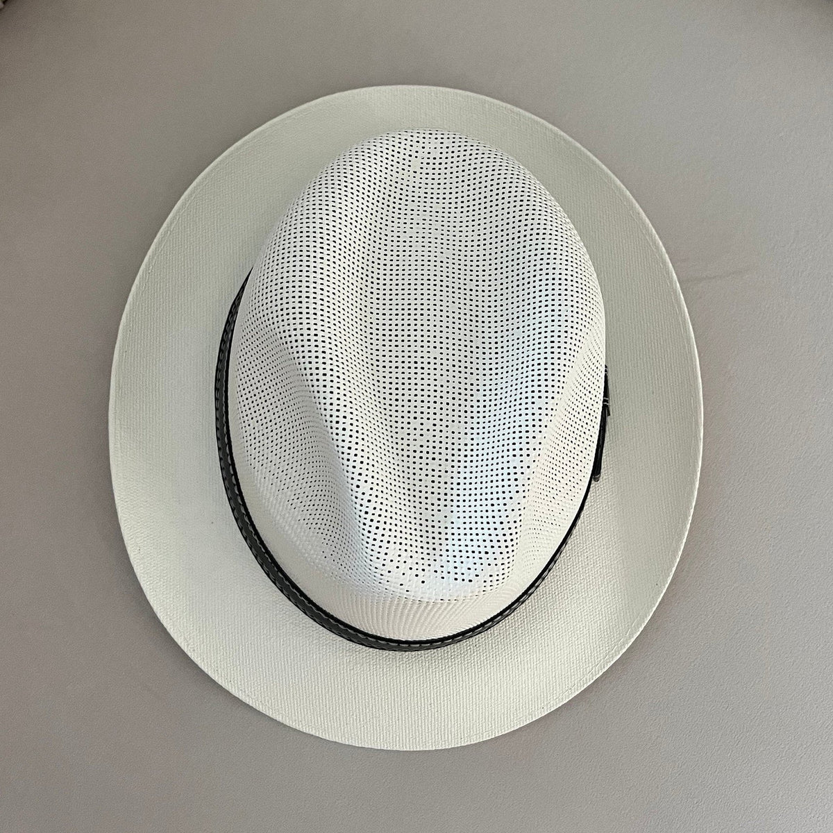 Top view of Mara off-white fedora showing its pinched crown and short brim.